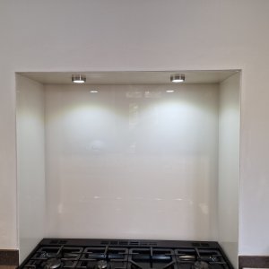 Polished glass splash back with easy clean coating